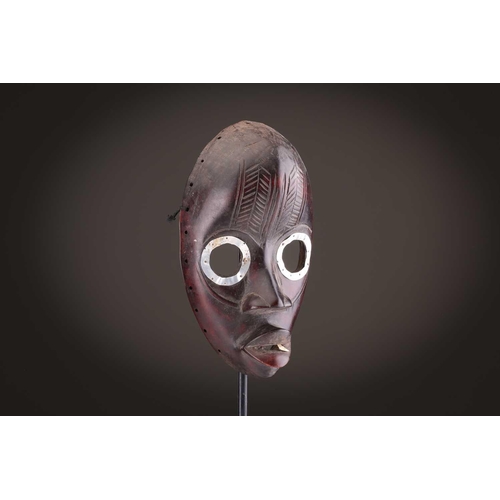 65 - A group of nine Dan masks, Liberia, to include two bird masks and three passport masks, 12.5cm - 32c... 