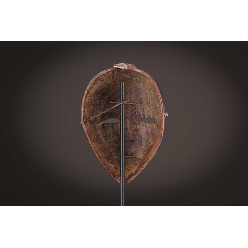 65 - A group of nine Dan masks, Liberia, to include two bird masks and three passport masks, 12.5cm - 32c... 