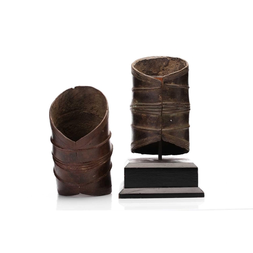 66 - Two Ekonde/Ekonda bronze currency bangles, Democratic Republic of Congo, 20th century, one with vert... 