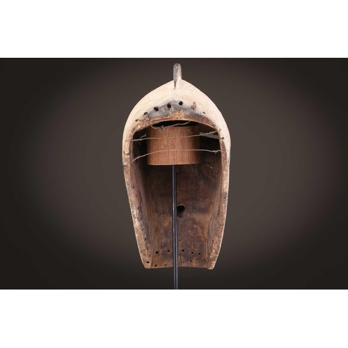 68 - Three Luba kifwebe, Democratic Republic of Congo, with incised linear decoration, painted in black &... 