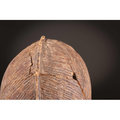 68 - Three Luba kifwebe, Democratic Republic of Congo, with incised linear decoration, painted in black &... 