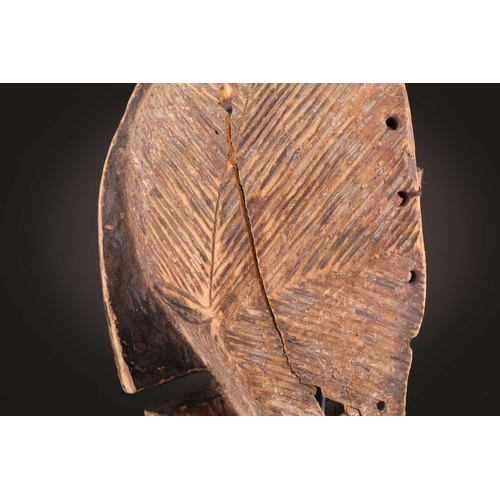 68 - Three Luba kifwebe, Democratic Republic of Congo, with incised linear decoration, painted in black &... 