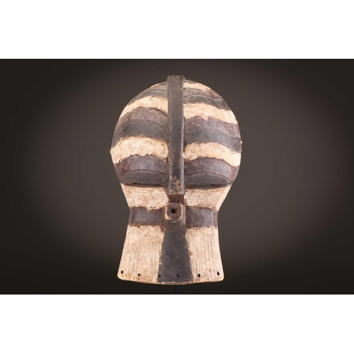 68 - Three Luba kifwebe, Democratic Republic of Congo, with incised linear decoration, painted in black &... 