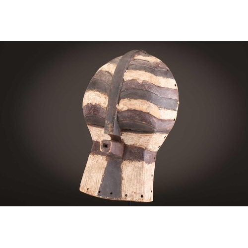 68 - Three Luba kifwebe, Democratic Republic of Congo, with incised linear decoration, painted in black &... 