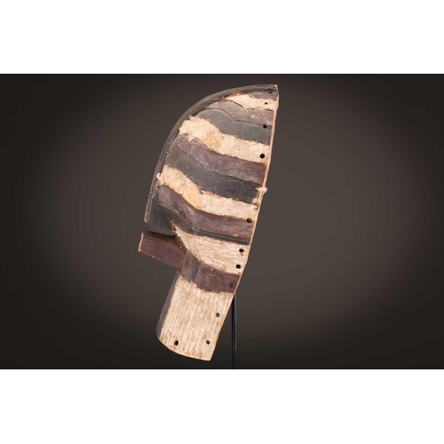 68 - Three Luba kifwebe, Democratic Republic of Congo, with incised linear decoration, painted in black &... 