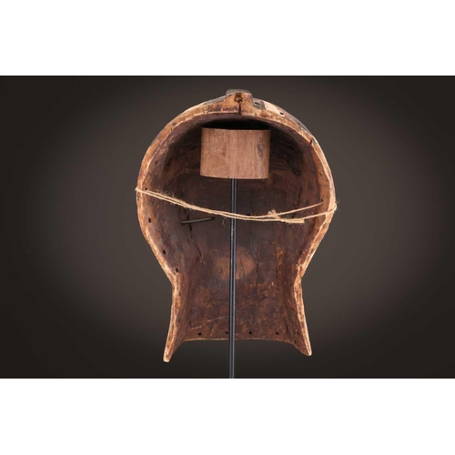 68 - Three Luba kifwebe, Democratic Republic of Congo, with incised linear decoration, painted in black &... 
