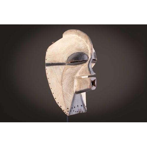 68 - Three Luba kifwebe, Democratic Republic of Congo, with incised linear decoration, painted in black &... 
