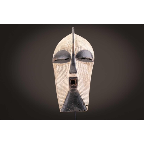 68 - Three Luba kifwebe, Democratic Republic of Congo, with incised linear decoration, painted in black &... 