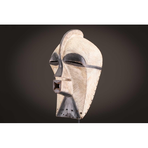 68 - Three Luba kifwebe, Democratic Republic of Congo, with incised linear decoration, painted in black &... 