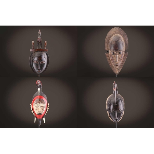 69 - Four Baule masks, Ivory Coast, three of zoomorphic form, one with linear coiffure, 33cm - 48.5cmThe ... 