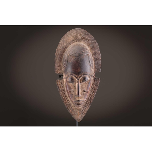 69 - Four Baule masks, Ivory Coast, three of zoomorphic form, one with linear coiffure, 33cm - 48.5cmThe ... 