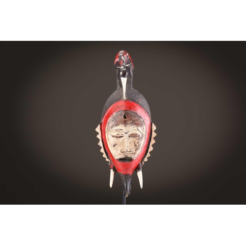 69 - Four Baule masks, Ivory Coast, three of zoomorphic form, one with linear coiffure, 33cm - 48.5cmThe ... 