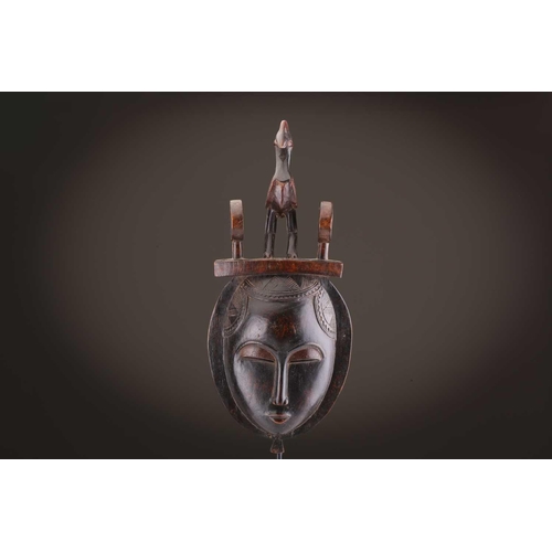 69 - Four Baule masks, Ivory Coast, three of zoomorphic form, one with linear coiffure, 33cm - 48.5cmThe ... 