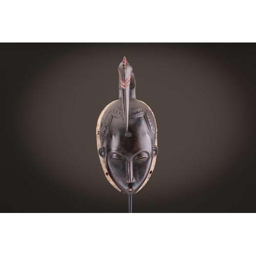 69 - Four Baule masks, Ivory Coast, three of zoomorphic form, one with linear coiffure, 33cm - 48.5cmThe ... 
