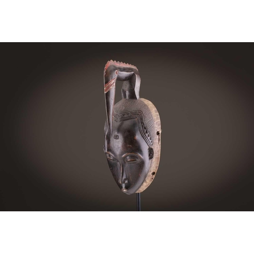 69 - Four Baule masks, Ivory Coast, three of zoomorphic form, one with linear coiffure, 33cm - 48.5cmThe ... 