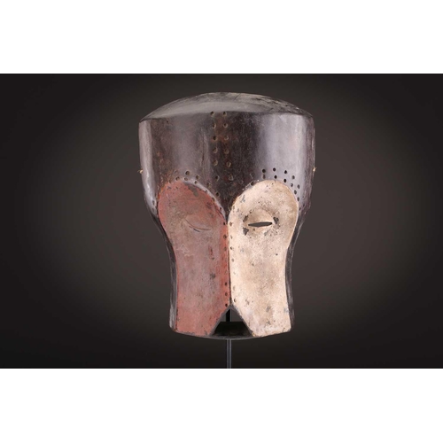 74 - A Ngbaka mask, Democratic Republic of Congo,the hollowed eye sockets painted red & white, the red ey... 