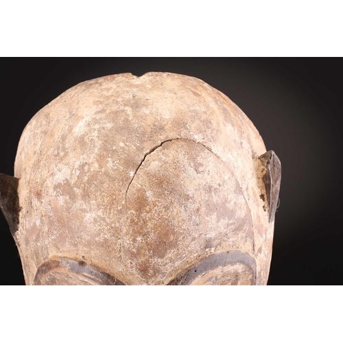 74 - A Ngbaka mask, Democratic Republic of Congo,the hollowed eye sockets painted red & white, the red ey... 