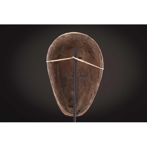 74 - A Ngbaka mask, Democratic Republic of Congo,the hollowed eye sockets painted red & white, the red ey... 
