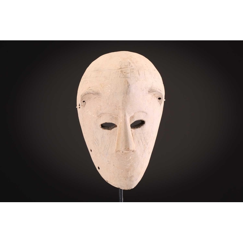 74 - A Ngbaka mask, Democratic Republic of Congo,the hollowed eye sockets painted red & white, the red ey... 