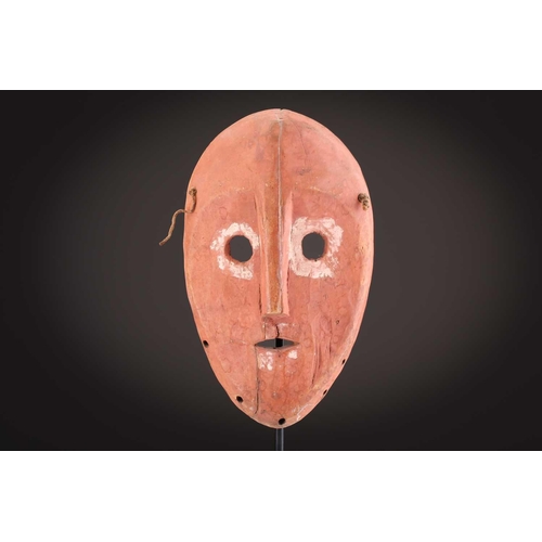 74 - A Ngbaka mask, Democratic Republic of Congo,the hollowed eye sockets painted red & white, the red ey... 
