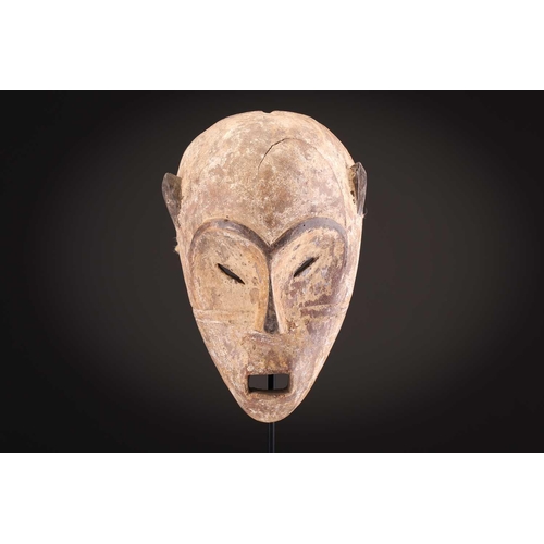 74 - A Ngbaka mask, Democratic Republic of Congo,the hollowed eye sockets painted red & white, the red ey... 