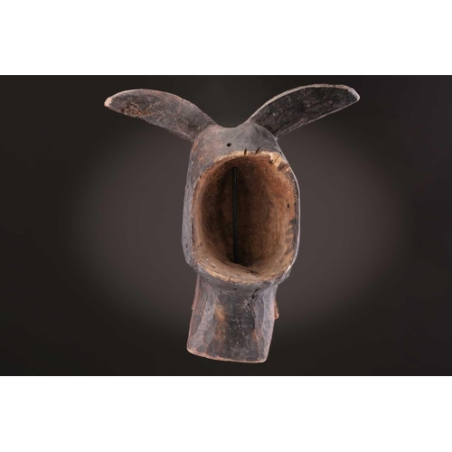 75 - A Mambila zoomorphic mask, Nigeria, painted with blue and white spots on a black ground, the mouth a... 
