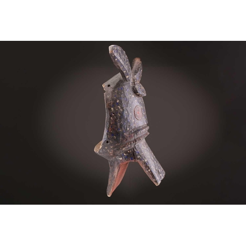 75 - A Mambila zoomorphic mask, Nigeria, painted with blue and white spots on a black ground, the mouth a... 