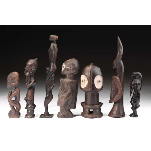 76 - A Ndaka (Ndaaka) figural drum, Democratic Republic of Congo, a vacant aperture to the crown of the h... 