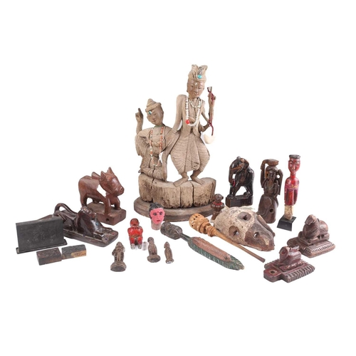77 - A collection of Indonesian and Indian carved wood anthropomorphic and zoomorphic figures, to include... 