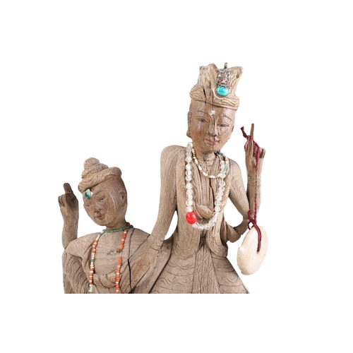 77 - A collection of Indonesian and Indian carved wood anthropomorphic and zoomorphic figures, to include... 