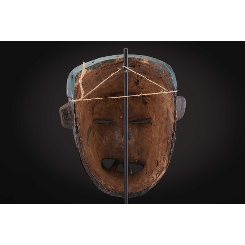 78 - Two Indonesian sickness type masks, painted in colours, 31cm & 32cm, two further masks, 20.5cm - 35c... 