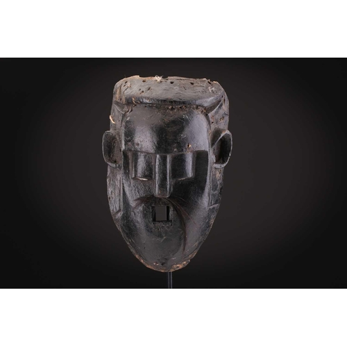 78 - Two Indonesian sickness type masks, painted in colours, 31cm & 32cm, two further masks, 20.5cm - 35c... 