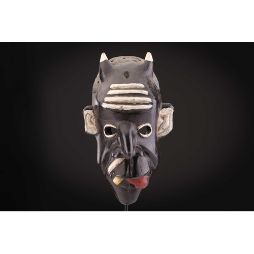 78 - Two Indonesian sickness type masks, painted in colours, 31cm & 32cm, two further masks, 20.5cm - 35c... 