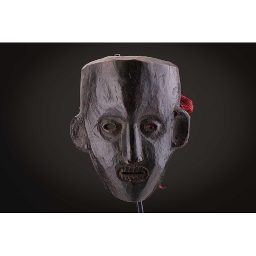 78 - Two Indonesian sickness type masks, painted in colours, 31cm & 32cm, two further masks, 20.5cm - 35c... 
