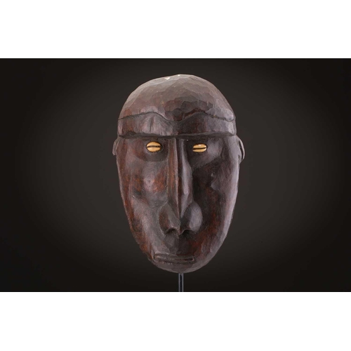 78 - Two Indonesian sickness type masks, painted in colours, 31cm & 32cm, two further masks, 20.5cm - 35c... 