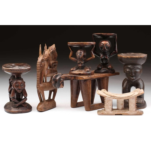 79 - A small Luba Hemba double caryatid stool, Democratic Republic of Congo, the oval top above a seated ... 