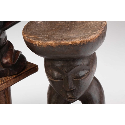 79 - A small Luba Hemba double caryatid stool, Democratic Republic of Congo, the oval top above a seated ... 
