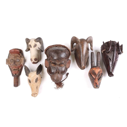82 - A collection of zoomorphic masks, to include a Luba boar and ram, a Pende horned beast, painted with... 
