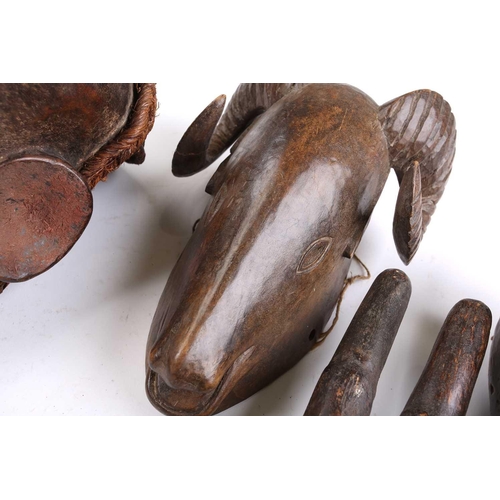 82 - A collection of zoomorphic masks, to include a Luba boar and ram, a Pende horned beast, painted with... 