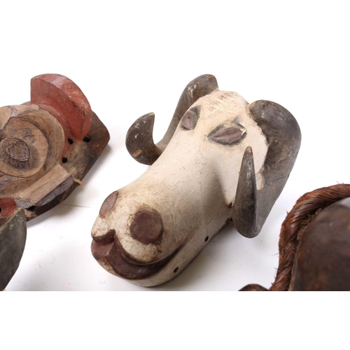82 - A collection of zoomorphic masks, to include a Luba boar and ram, a Pende horned beast, painted with... 