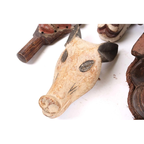 82 - A collection of zoomorphic masks, to include a Luba boar and ram, a Pende horned beast, painted with... 