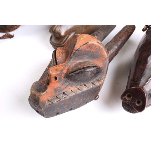 82 - A collection of zoomorphic masks, to include a Luba boar and ram, a Pende horned beast, painted with... 