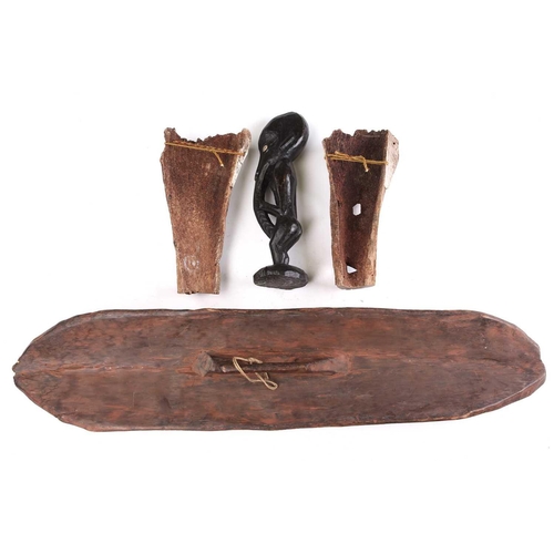 84 - A Sepik River ancestor figure, with cowrie shell eyes and long beak, 41.5cm, two South Seas animal b... 