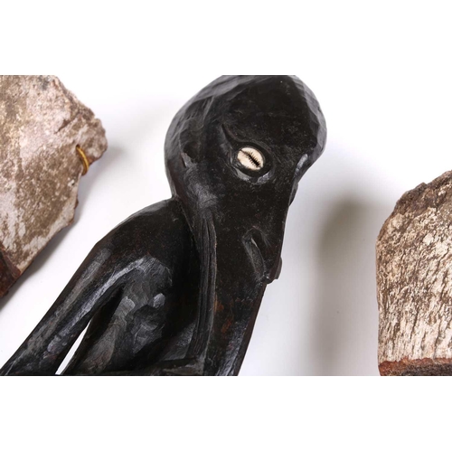 84 - A Sepik River ancestor figure, with cowrie shell eyes and long beak, 41.5cm, two South Seas animal b... 