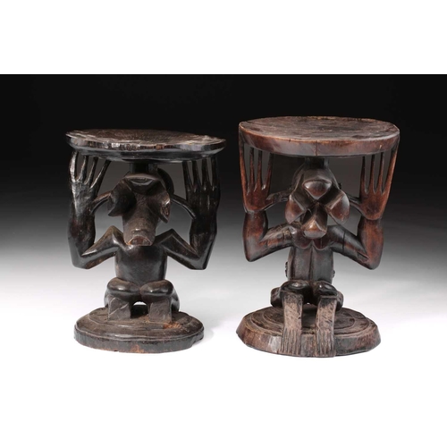 85 - Two Luba female caryatid stools, Democratic Republic of Congo, carved kneeling and supporting a circ... 