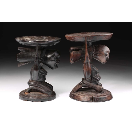85 - Two Luba female caryatid stools, Democratic Republic of Congo, carved kneeling and supporting a circ... 
