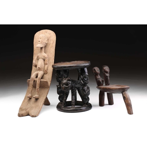 86 - A Bamileke stool, Cameroon, the circular top supported by two male figures flanking a leopard, colou... 