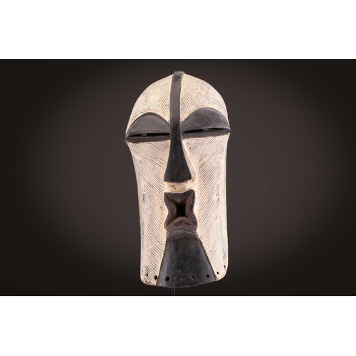 89 - A Songye Kikashi kifwebe, Democratic Republic of Congo, with fine incised linear carving and protrud... 