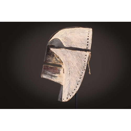 89 - A Songye Kikashi kifwebe, Democratic Republic of Congo, with fine incised linear carving and protrud... 
