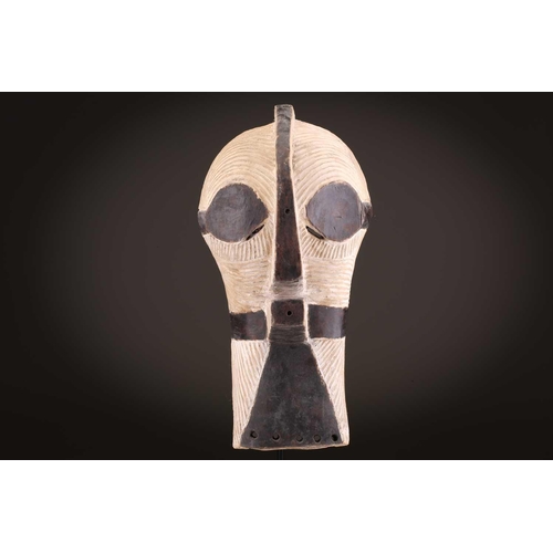 89 - A Songye Kikashi kifwebe, Democratic Republic of Congo, with fine incised linear carving and protrud... 
